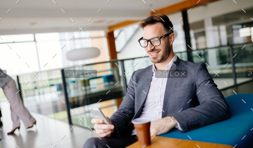 demo-attachment-1475-businessman-taking-a-break-with-a-cup-of-coffee-JW4B3DH